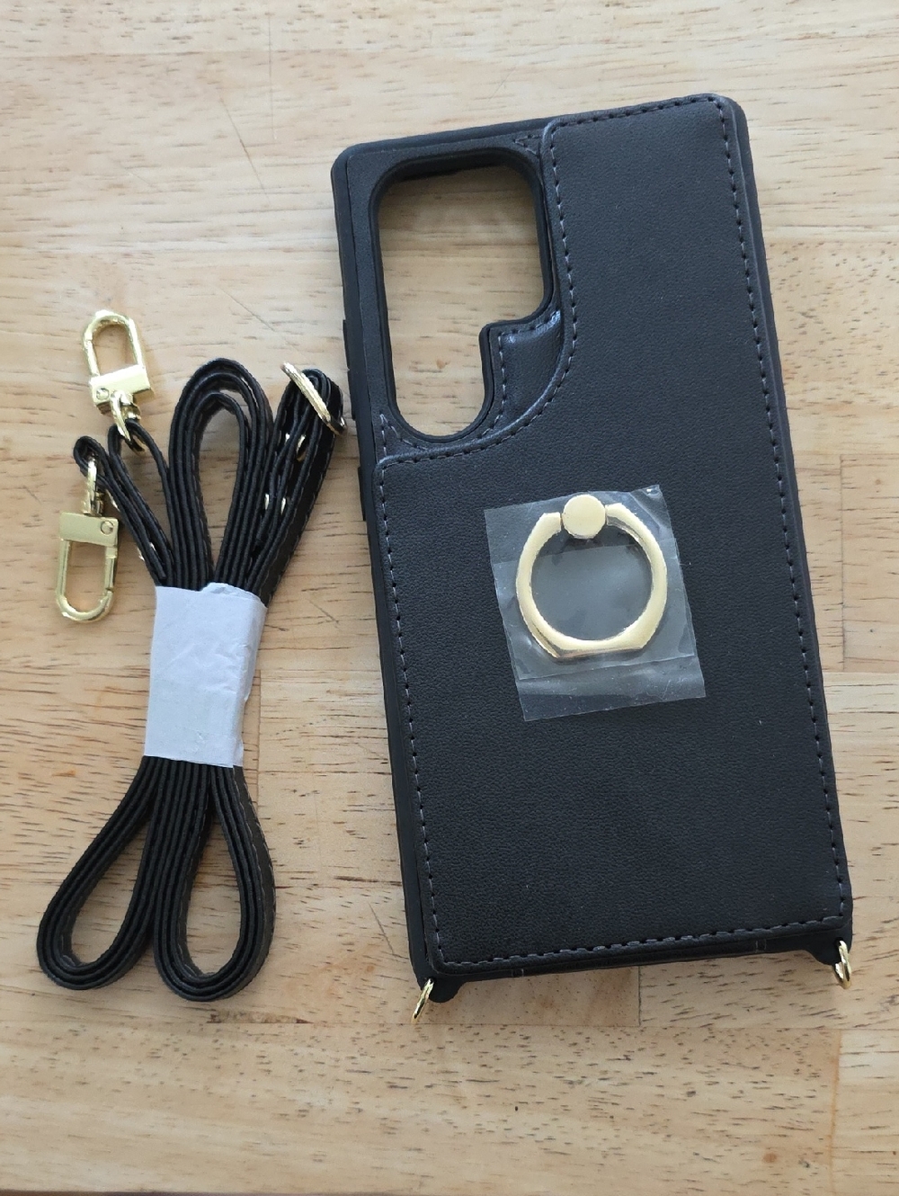 Black Phone Crossbody Case with Gold Ring and Strap